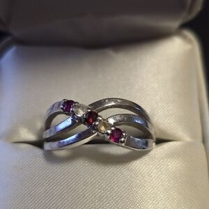 White Gold Infinity Ring with Rubys and Diamond Stones